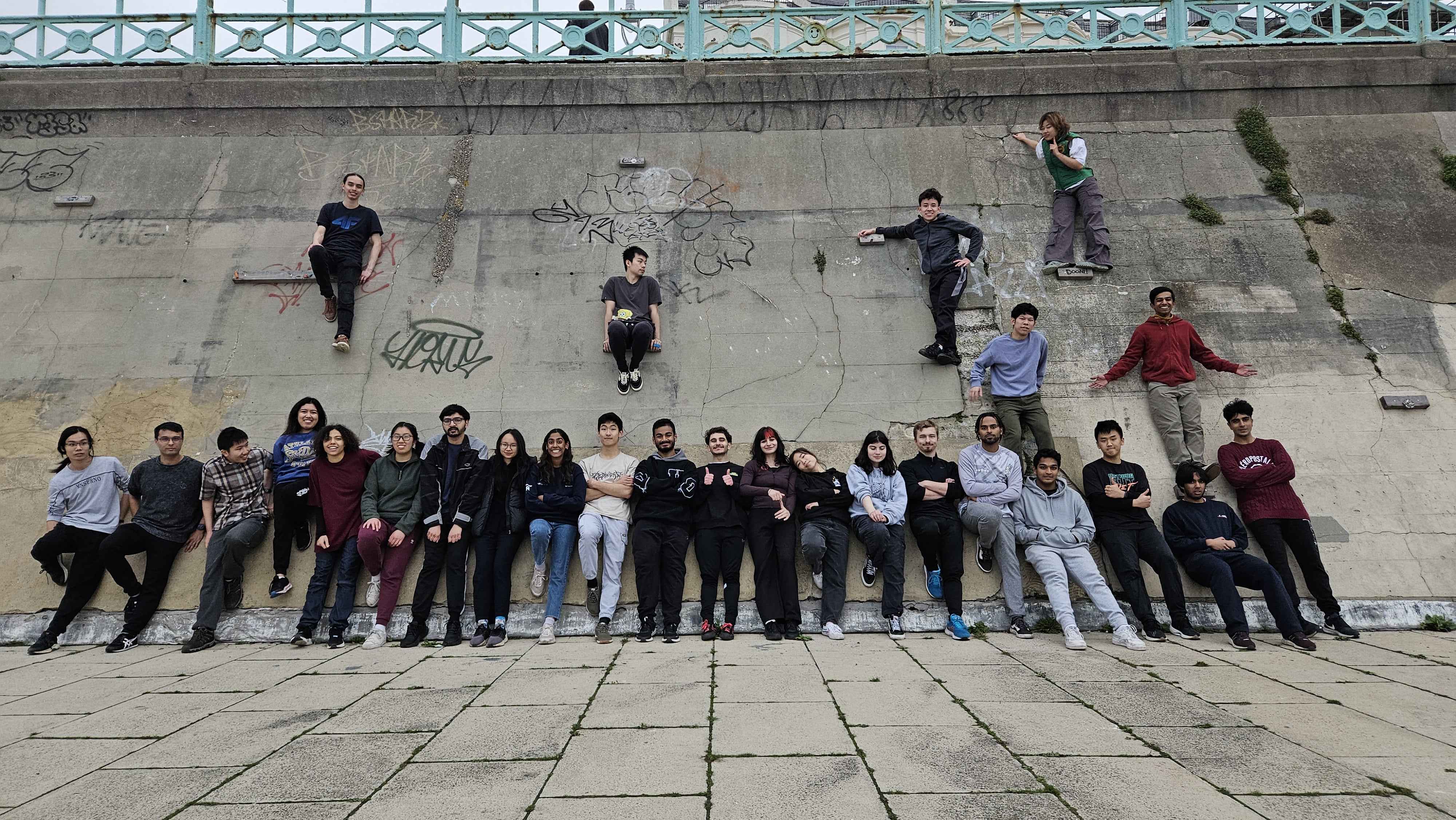 A large group of Parkour Club members leaning against Brighton's 'Big Wall'.