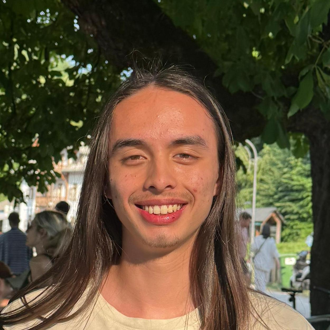 A photograph of the face of Mariusz Tang.